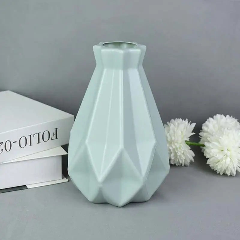 a vase with a flower in it