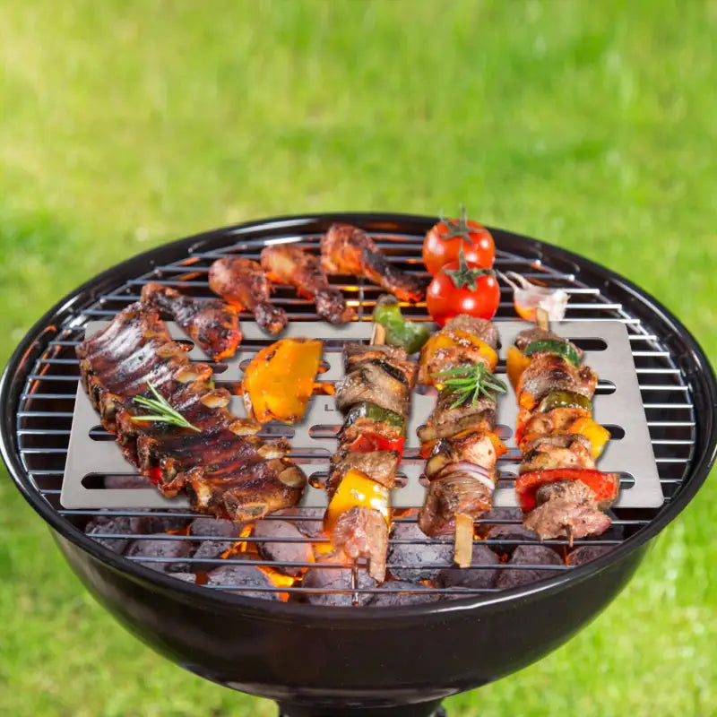 a grill with meat and vegetables on it