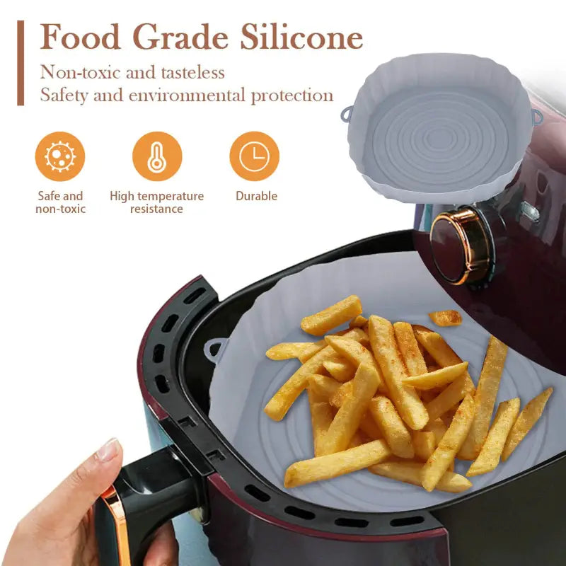 a person is putting french fries into a slow fryer