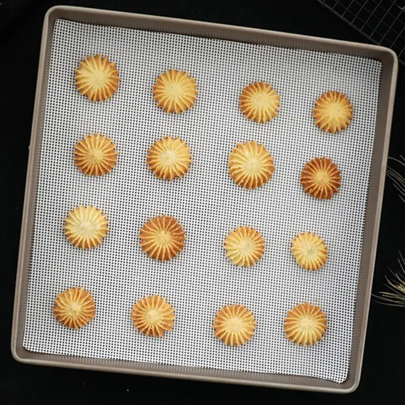 a baking sheet with a baking tray filled with small cookies