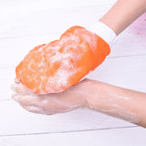 a person washing their hands with soap