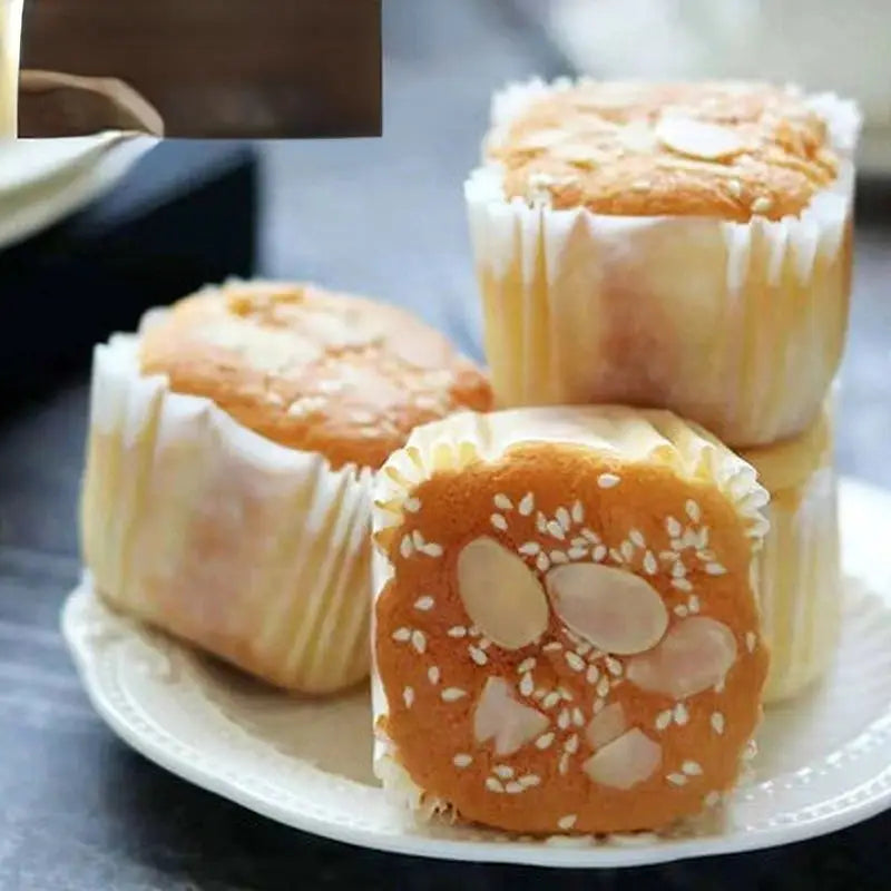 a plate with three small rolls on it