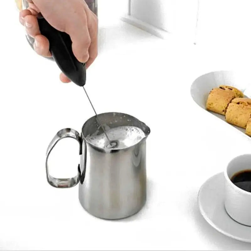 a person is pouring coffee into a cup