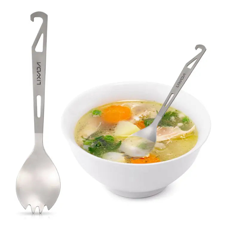 a bowl of soup with a spoon and spoon