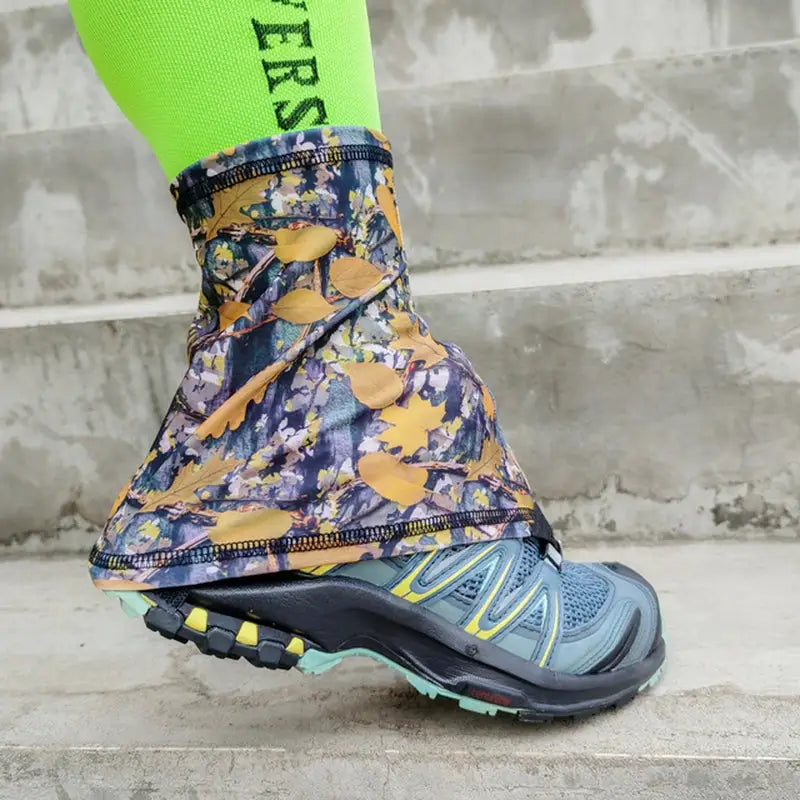 a close up of a person wearing a pair of shoes with a green sock