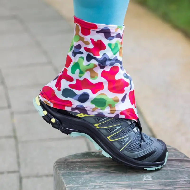 a woman wearing colorful socks and running shoes