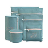 the aqua blue set includes three bags and three small pouchs