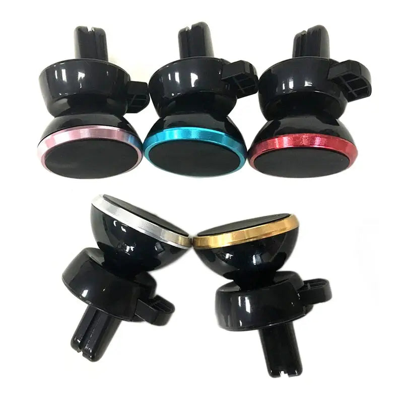 a set of four black and gold metal knobs