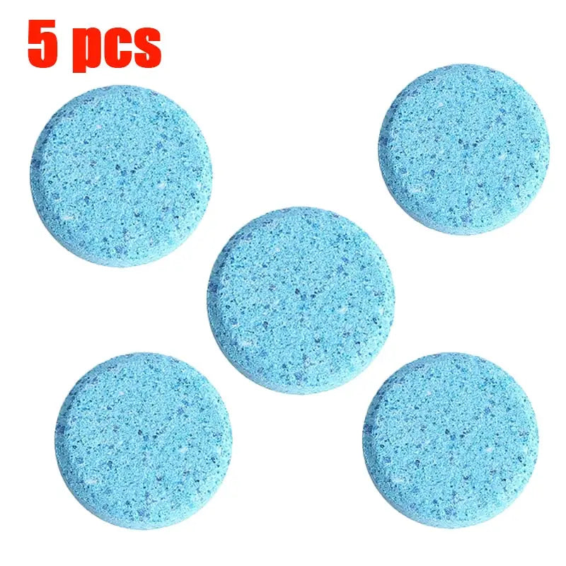 four blue sponges are arranged in a circle on a white surface