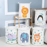a set of four canvas storage baskets with animals and plants