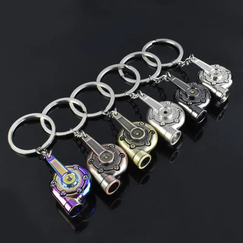 a set of four metal key chains with a lighter lighter