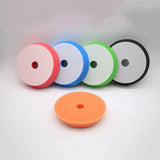 a set of four different colored plastic discs