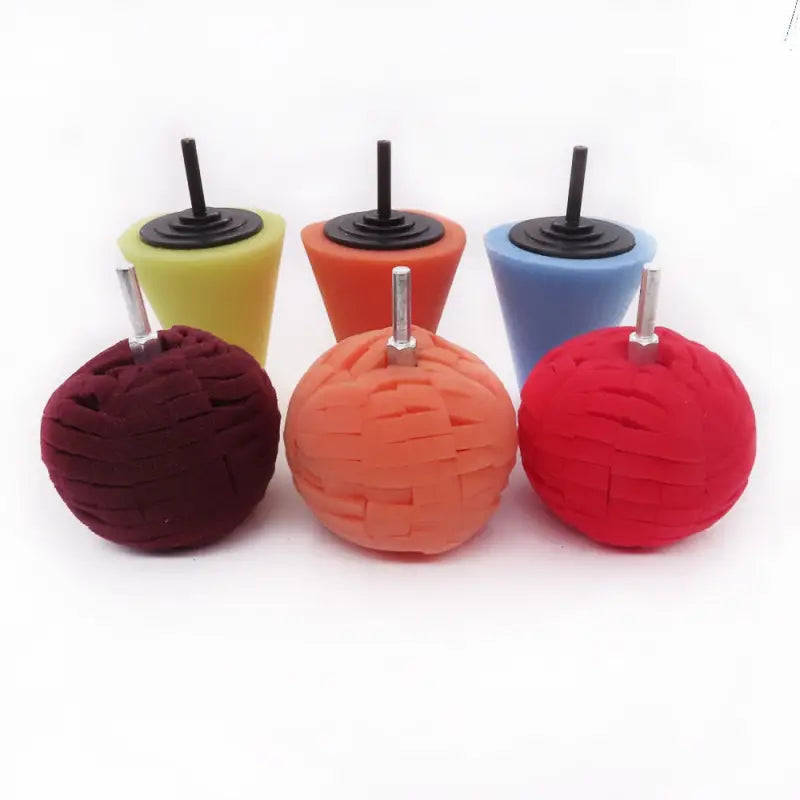 four different colored plastic ball shaped ice pops