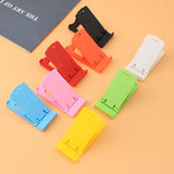 a set of four colorful plastic clips