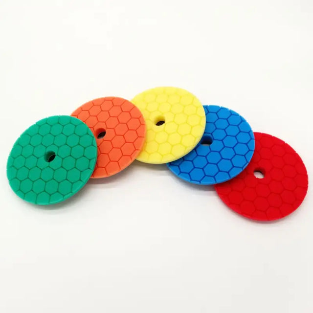 a set of four colorful hexal polish pads