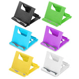 a set of four colorful plastic phone holders