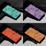 four different colors of leather wallet case