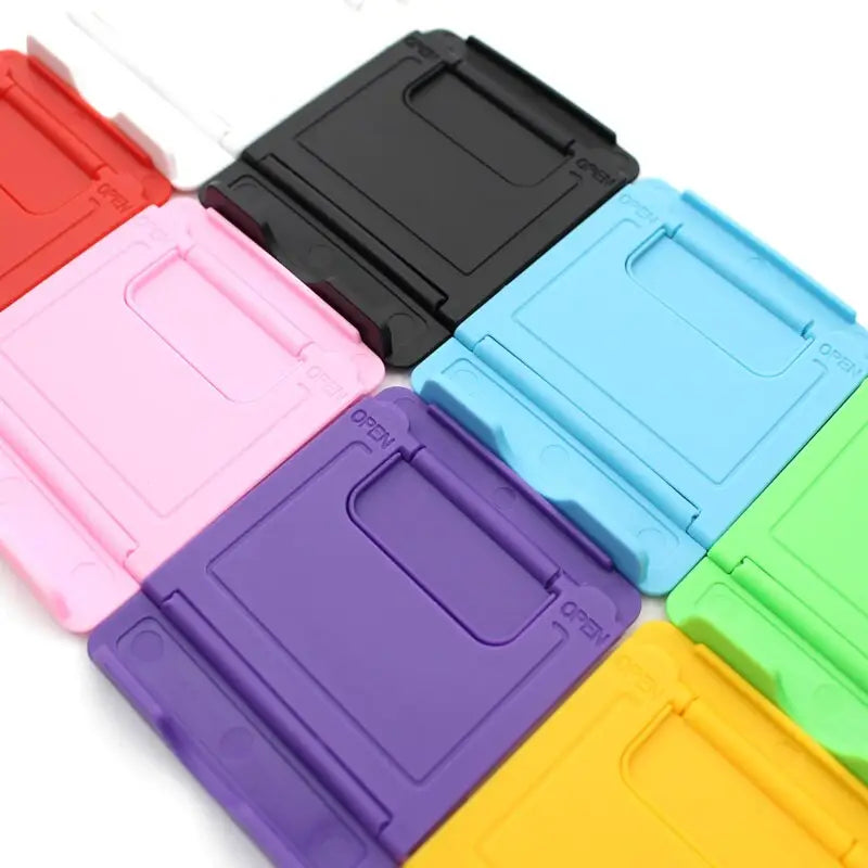 a set of four different colored plastic cases