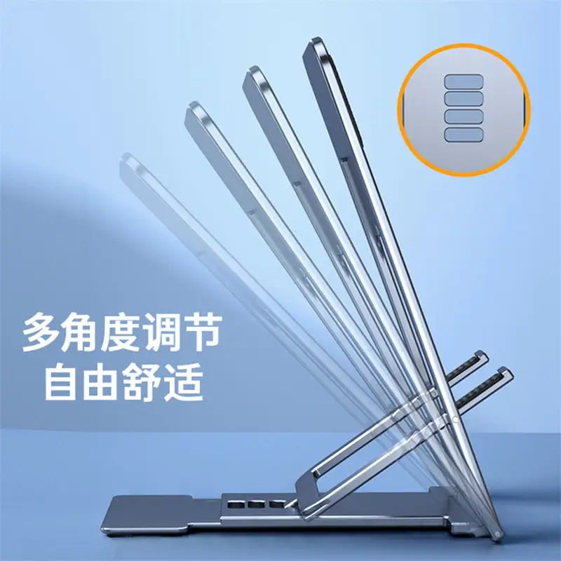 there are four pens and a laptop on a stand with a chinese text