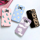 a phone case with a leopard and daisy pattern