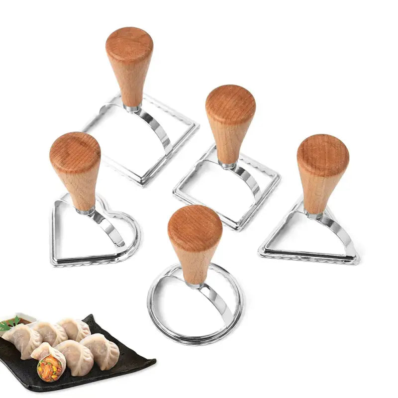 four pieces of meat cutters with a piece of meat on the side