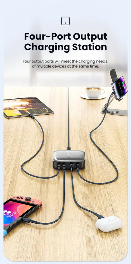 Four-port charging station with multiple devices connected via cables.