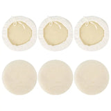 a set of four round white felt pads