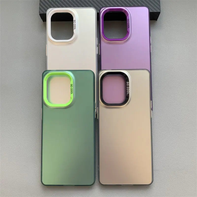 Four smartphone cases in different pastel colors with camera cutouts.