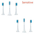 four toothbrushs with blue and white brushes