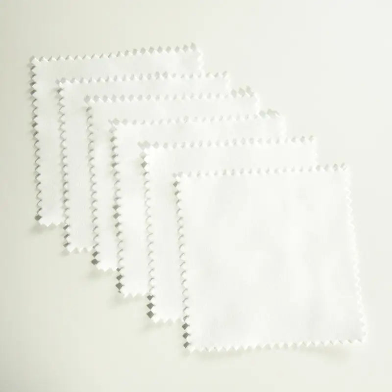 a set of four white plastic bags with a white background
