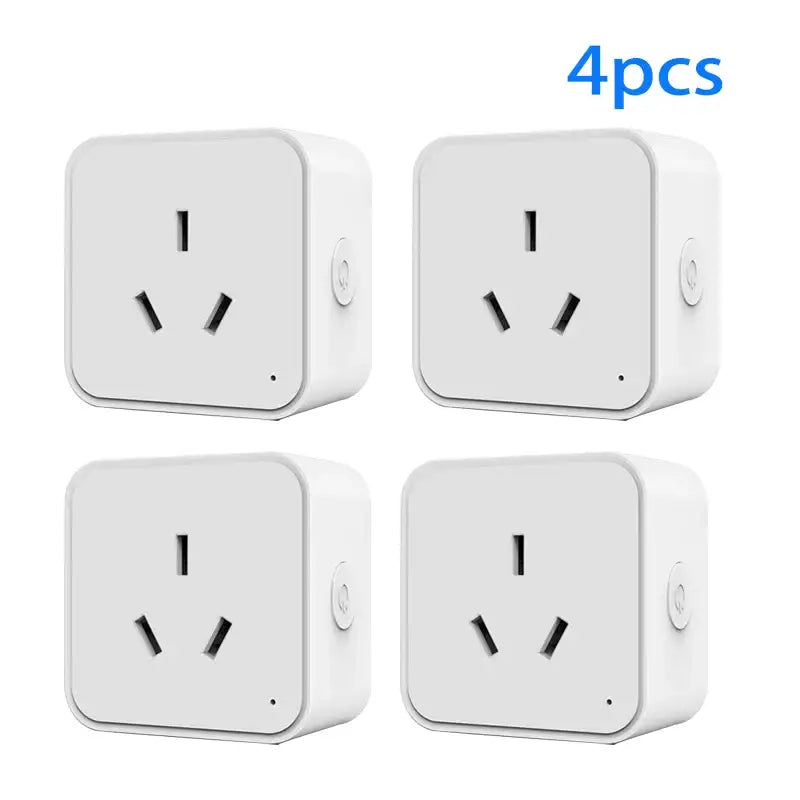 Four white square plugs with black wires and a white background