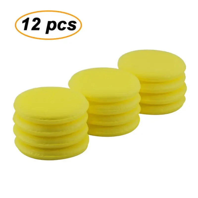 a set of four yellow foam discs with a white background
