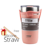 a close up of a pink tumbler with a straw and a gift
