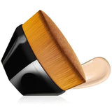 the face brush is a large, round brush with a wooden handle