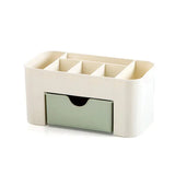 a white desk organizer with two compartments