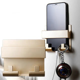 a phone and a camera hanging on a wall