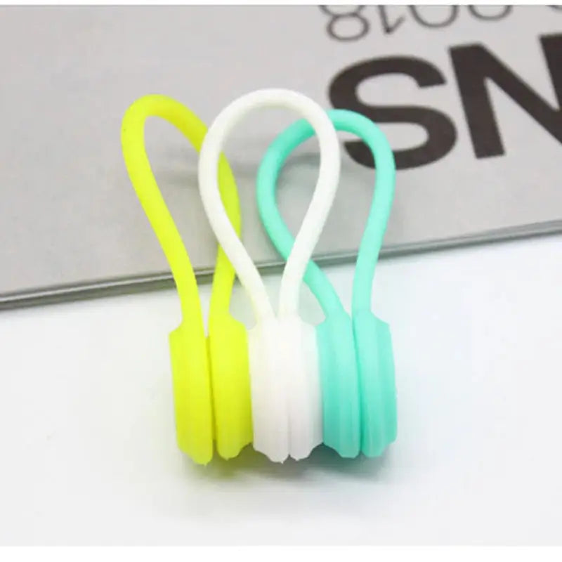 a pair of earphones with a white and green earband