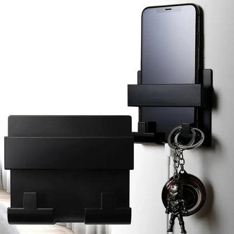 a phone and a key hanging on a wall