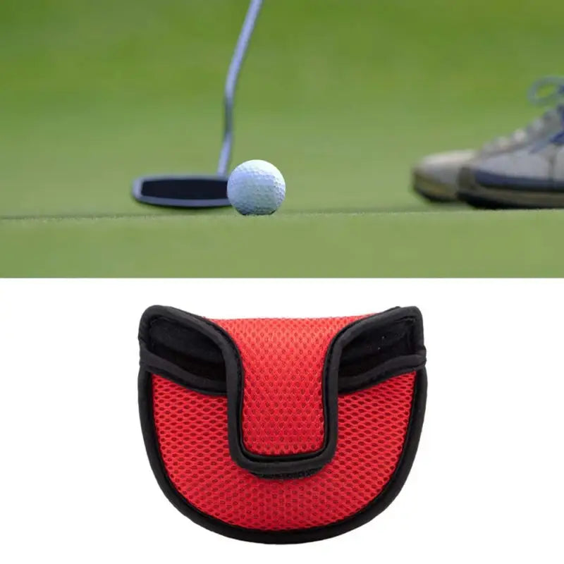 a golf ball and a golf putter