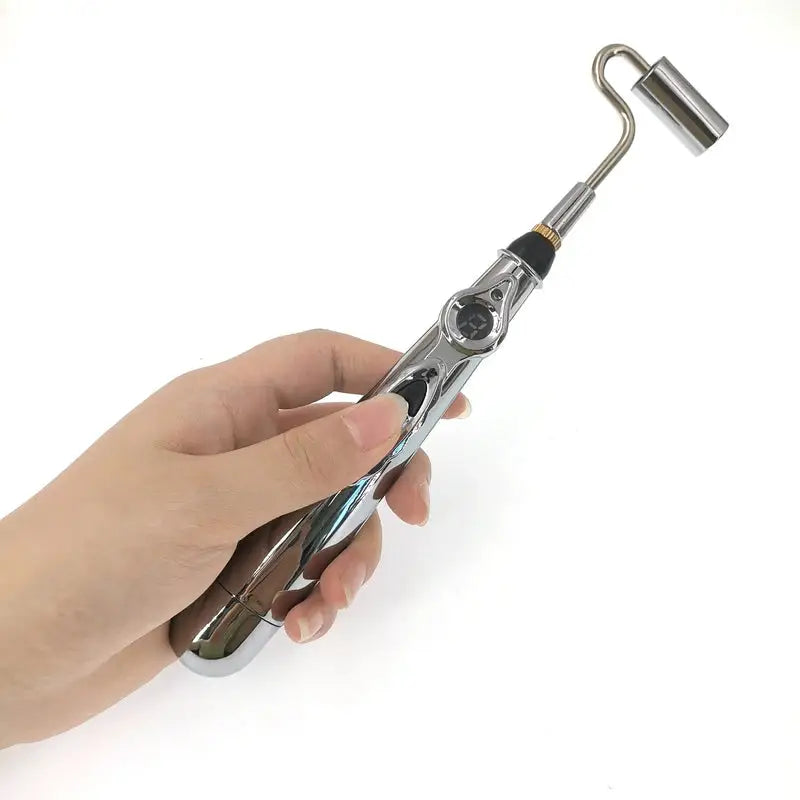 a hand holding a metal tool with a handle