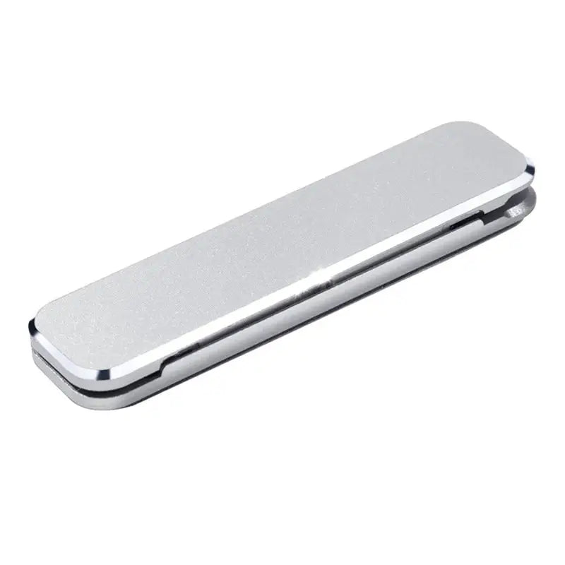 a silver money clip on a white background