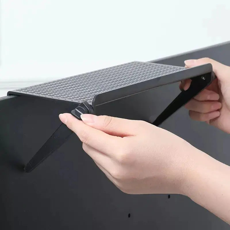 a person is opening a black box with a black handle