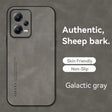 a close up of a phone with a gray background and a text that reads authentic sheep bark