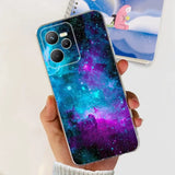 a hand holding a phone case with a galaxy design