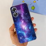 a hand holding a phone case with a galaxy pattern