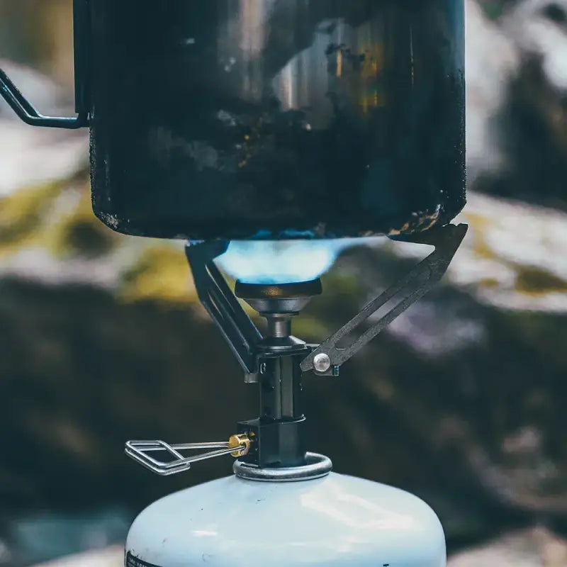 a gas stove with a blue flame on it