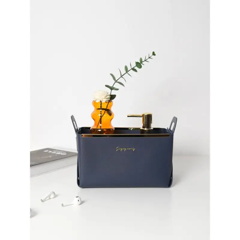 the navy blue leather desk organizer with a plant in it