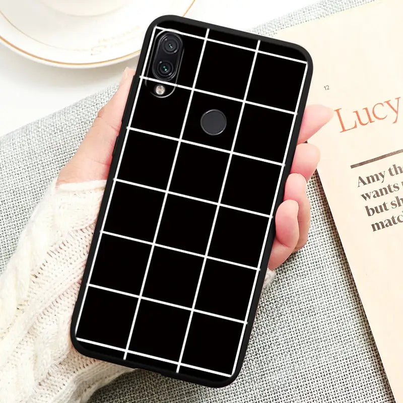 a black and white geometric pattern phone case
