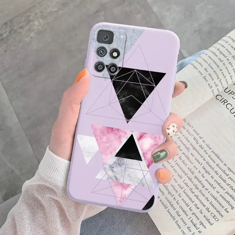 someone holding a phone case with a geometric design on it