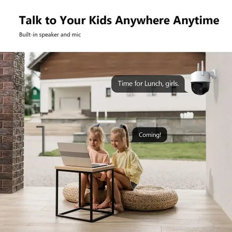 A little girl sitting on a chair with a laptop